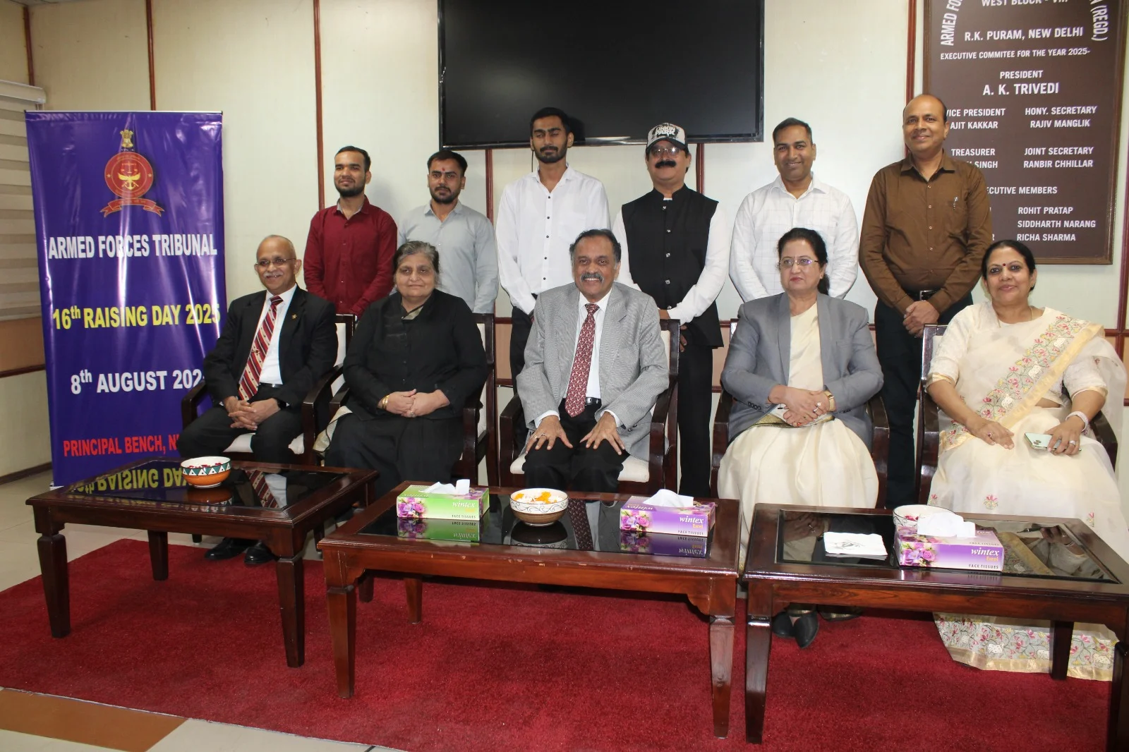 Company representatives and guests attending a formal corporate recognition and award ceremony